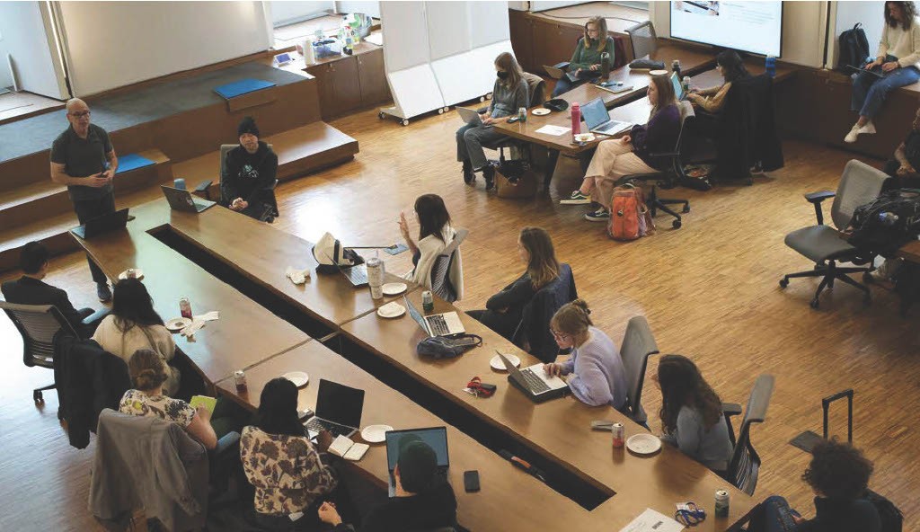 Top-down view of a gathering at the Brown Institute for Media Innovation. 