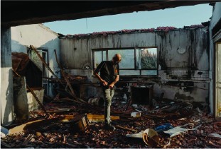 Gal Cohen, the secretary-general of Be’eri, in a destroyed home in Kibbutz Be’eri. Photo credit: Ofir Berman for The New Yorker Gal Cohen, the secretary-general of Be’eri, in a destroyed home in Kibbutz Be’eri.Photographs by Ofir Berman for The New Yorker
