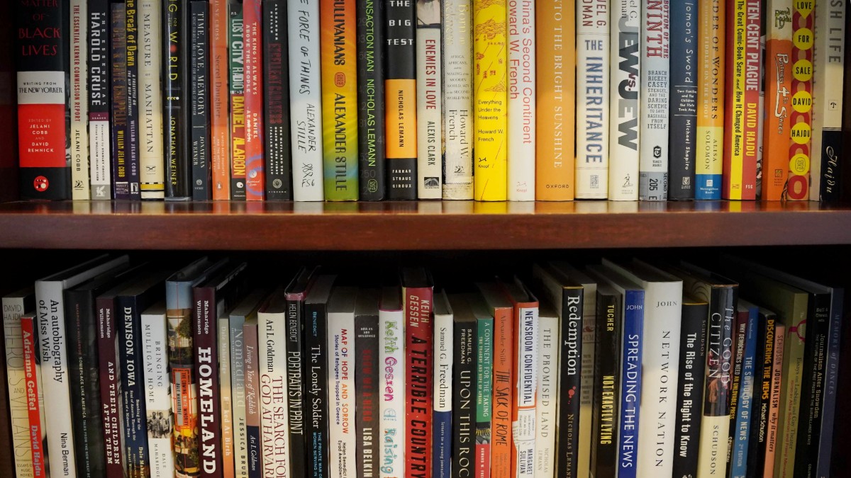 Bookshelf with various publications from CJS faculty. 