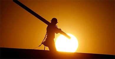 A home builder works at sunrise on a summer day in 2016, in Gilbert, Ariz., in an effort to beat the rising temperatures. (AP Photo/Matt York) A home builder works at sunrise on a summer day in 2016, in Gilbert, Ariz., in an effort to beat the rising temperatures. (AP Photo/Matt York)