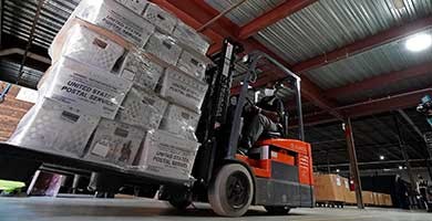 A forklift operator loads absentee ballots for mailing on Sept. 3, 2020, in Raleigh, North Carolina. (Gerry Broome/AP) A forklift operator loads absentee ballots for mailing on Sept. 3, 2020, in Raleigh, North Carolina. (Gerry Broome/AP)