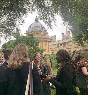 The famous Sherry Hour in Exeter College's Fellows Garden with Radcliffe Camera in the background.