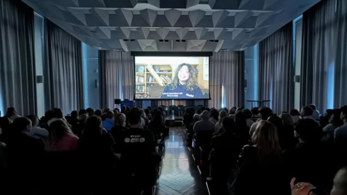 Dean Duy Linh Tu’s video class screens their documentaries during graduation week. Audience screening a documentary.