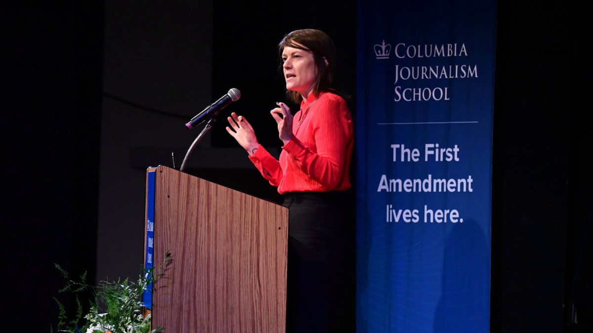 Woman speaking at a podium