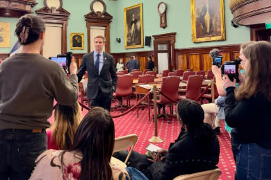 Students interview a city official at NYC City Hall. 