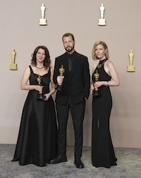 Photo of Aronson-Rath and others in the Oscars Press Room.