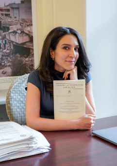 Azmat Khan, Patti Cadby Birch Assistant Professor of Journalism and Director Li Center for Global Journalism, with her latest work: “Mistakes In War.” Azmat Khan holding a copy of the University of Pennsylvania Law Review, Volume 173, Issue 1