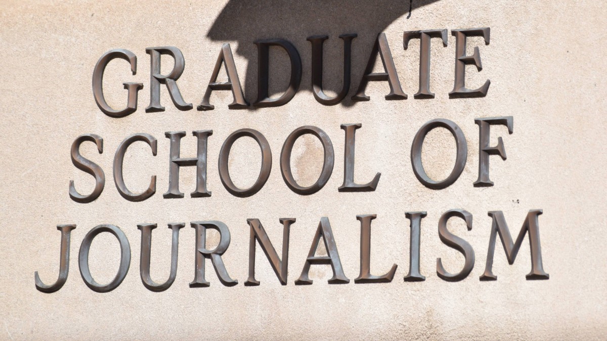 Writing near the entrance of Pulitzer Hall that reads "Graduate School of Journalism."
