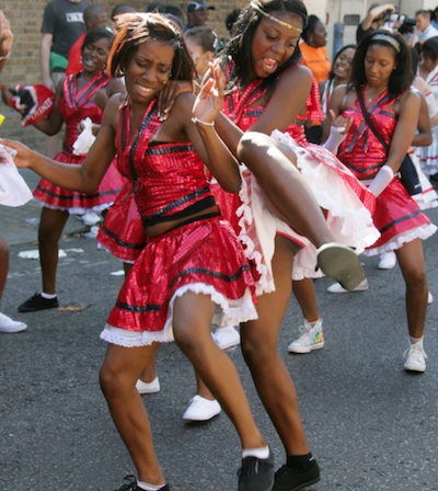 People at Carnival.  Right: Travelpix / Alamy Stock Photo