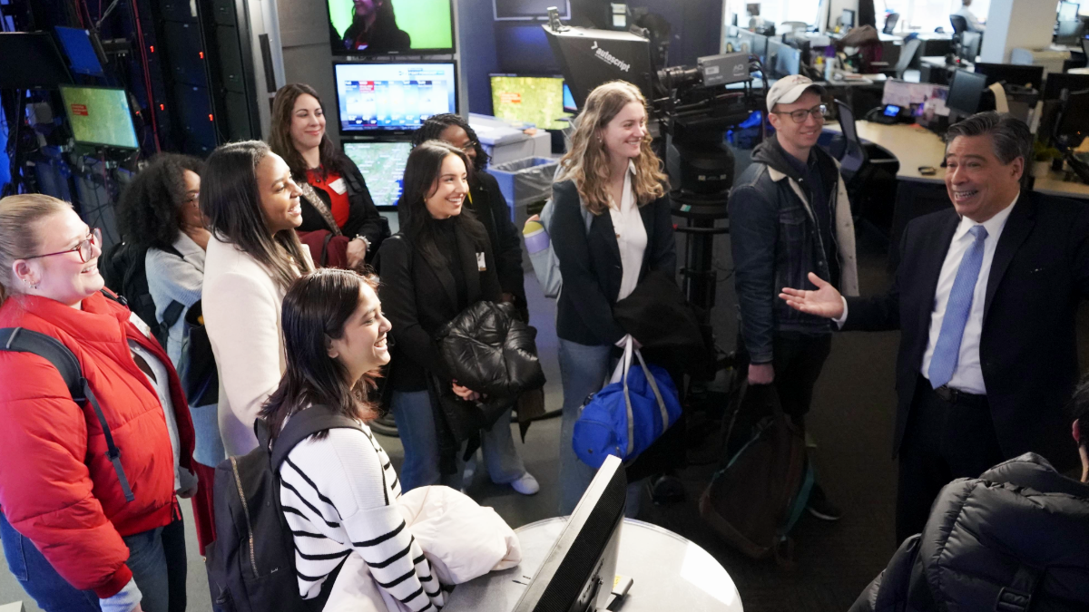Students in a broadcast studio. 