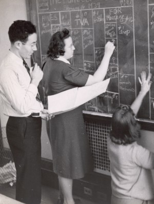 Students at Columbia Journalism School in the early-mid 1900s. Students at Columbia Journalism School writing on a chalkboard in the early-mid 1900s.