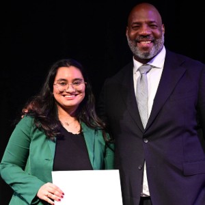2025 Pulitzer Traveling Fellow and Valedictorian Riddhi Kumari Setty, '25 M.S., with Dean Jelani Cobb. Two people pose for a photo.