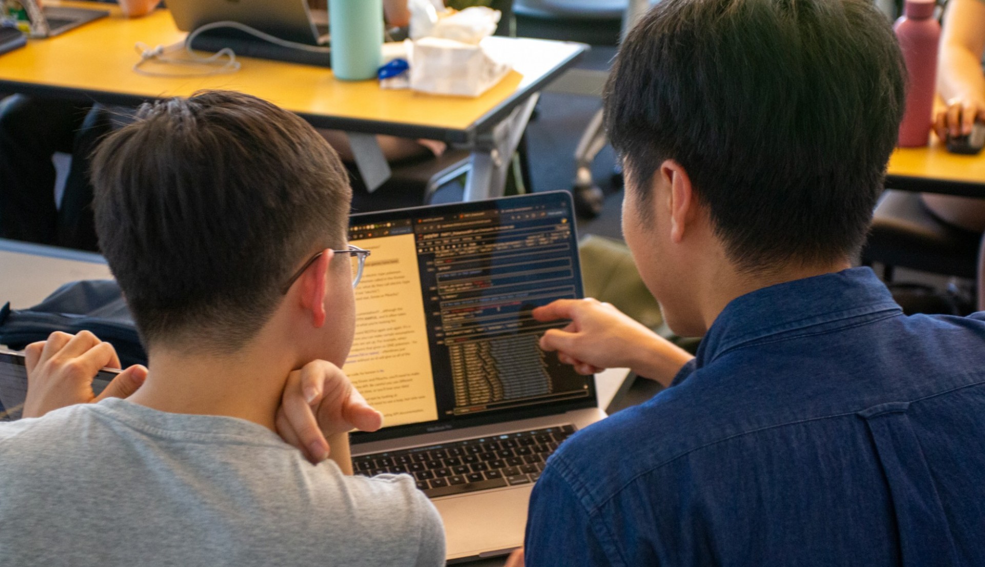 CJS students learning AI in the classroom. 
