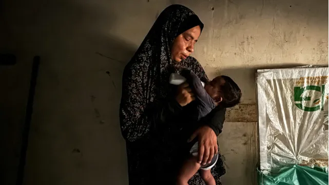 A Palestinian doctor tries to save severely malnourished children amid Israel’s US-backed illegal siege on Gaza. (Al Jazeera)
