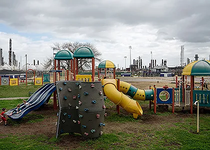 Children are seen at a playground across from the TCP Group plant that exploded in late 2019 in Port Neches, Texas, on Feb. 4, 2021. Photo: Verónica G. Cárdenas for The Intercept