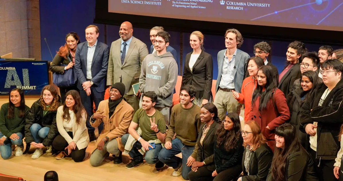 Group photo on a stage. 