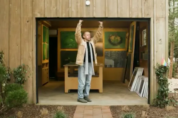Man opening a garage door. 