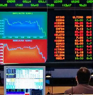 Reader boards at stock exchange, emphasis on business and economics for the Master of Arts in Business and Economics. 
