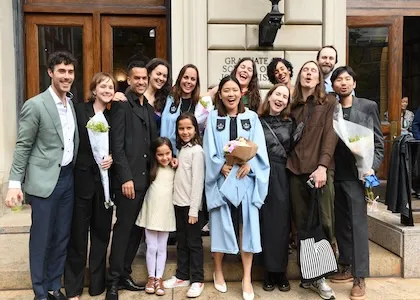 Group graduation photo outside Pulitzer Hall