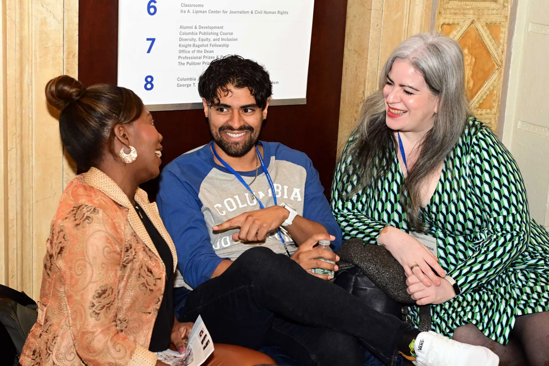 two women and one man chatting