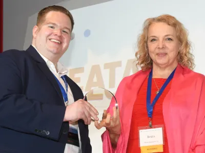 2026 Alumni Award recipient Beata Balogová, ’07 M.S., receives her award from CJS Alumni Board Chair Andrew Seaman, '11 M.S.