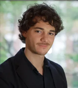Headshot of Chris Caurla, ’25 M.A. Politics.