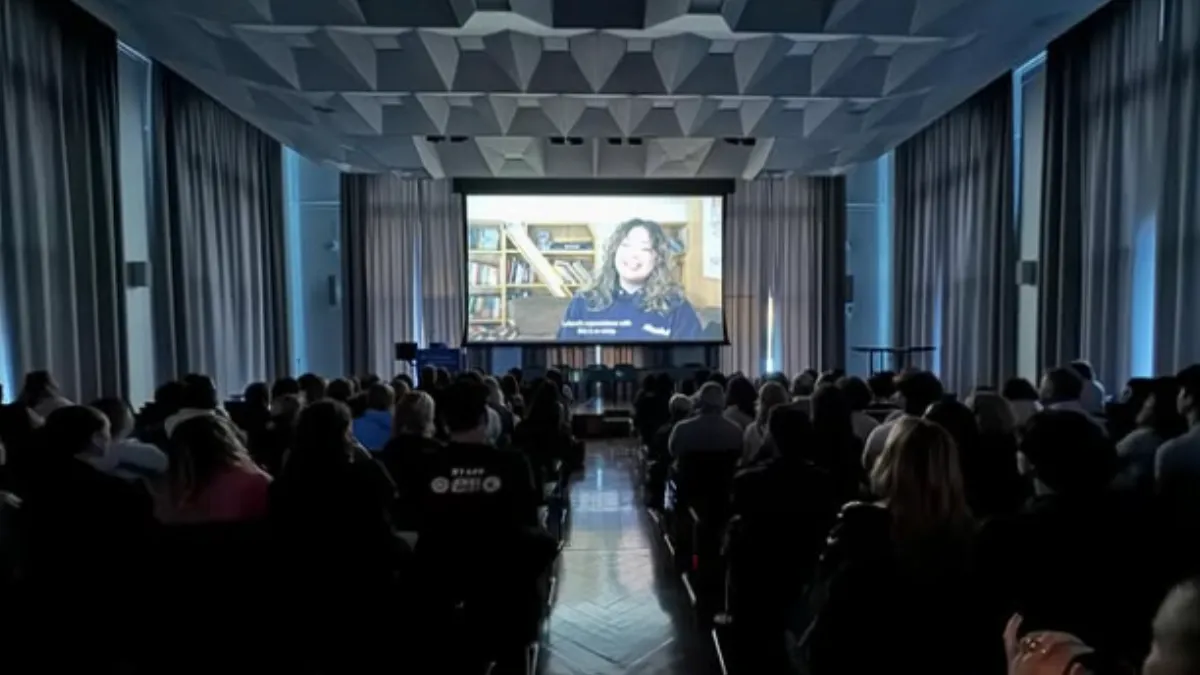Audience screening a documentary. 