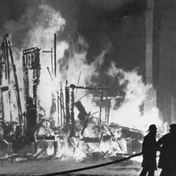 Photo of a burning building from The Riot Report