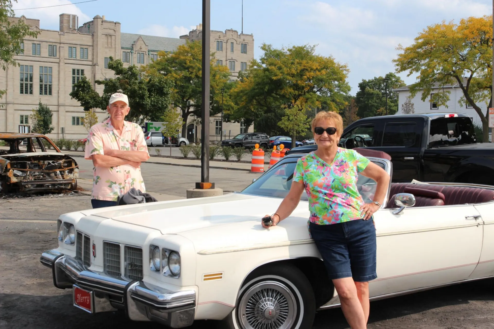 Harry and Bev spoke with Omokha at the Kenosha car lot burned during the city's unrest. Credit: Rita Omokha