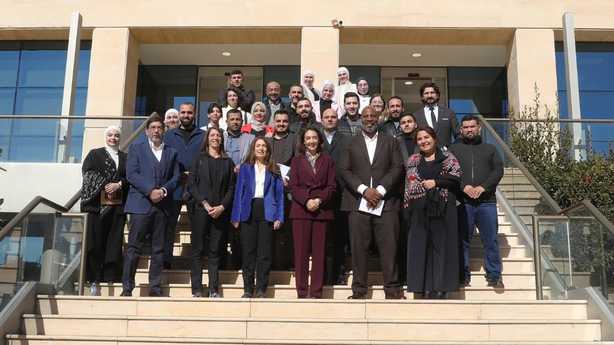 Dean Jelani Cobb, CJS faculty, and staff stand outside the Jordan Media Institute building