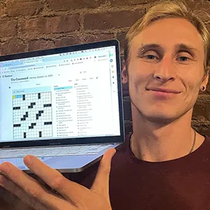 Dana Edwards, ‘25 M.S., showing the New York Times crossword published on October 13.