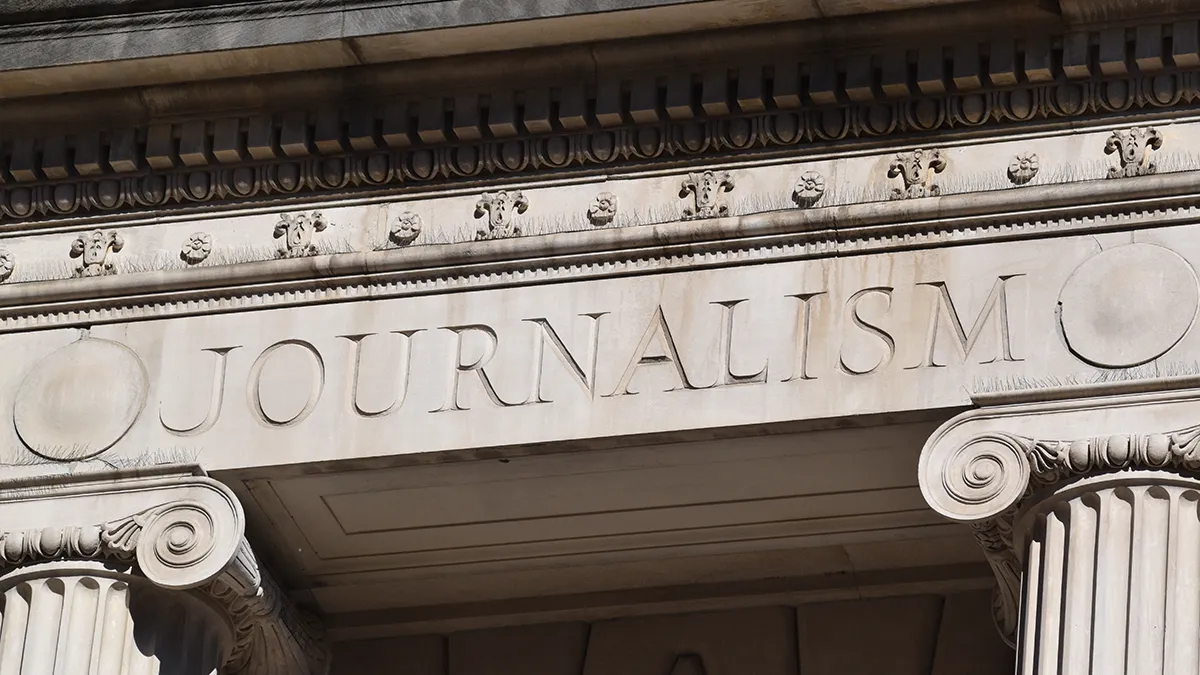 Stone inscription above the entrance to Pulitzer Hall that reads "Journalism."