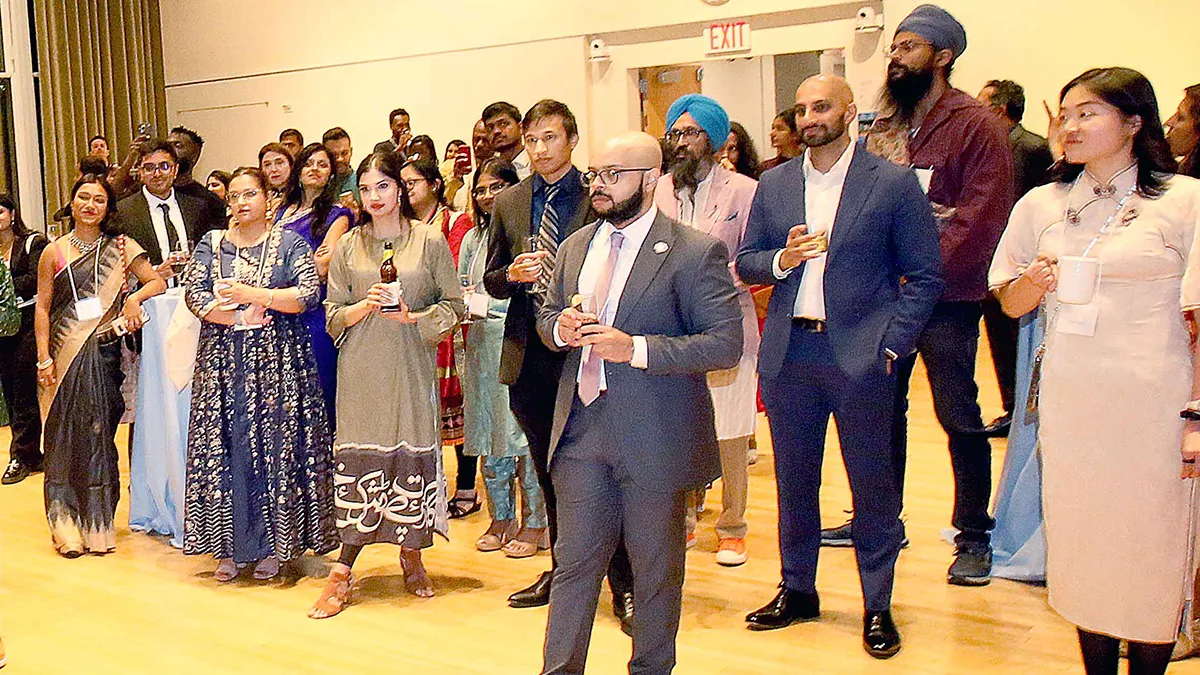 Attendees gather for the SAJA Awards Ceremony reception in the World Room in Pulitzer Hall. 