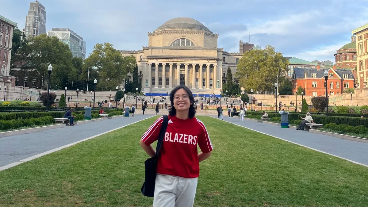 Thu Le, ‘26 M.S., standing in front of Low Library. 