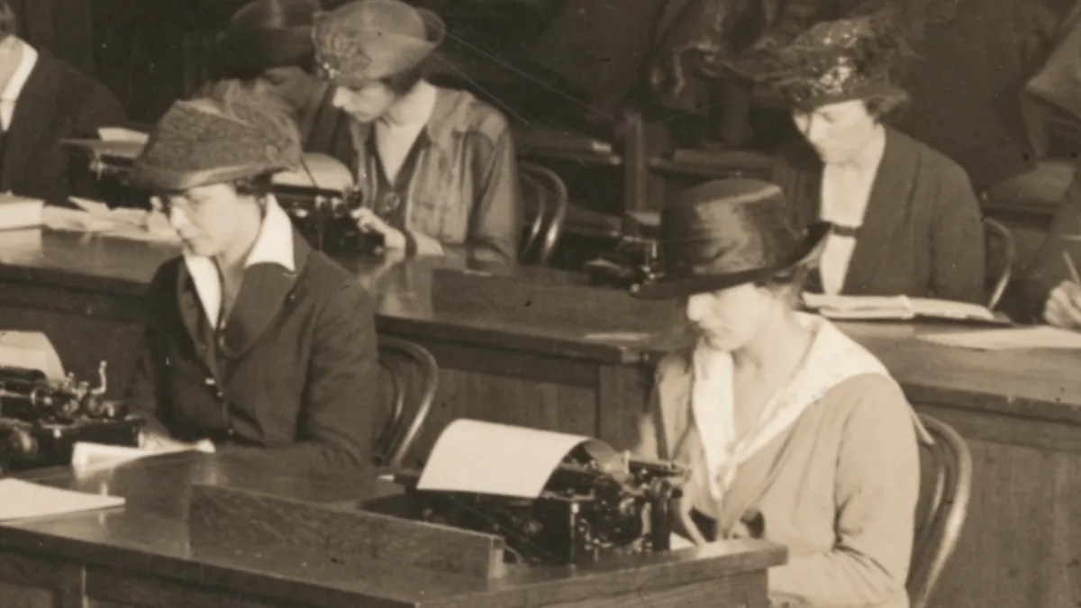 Historic photo of four women in 1918 typing. 