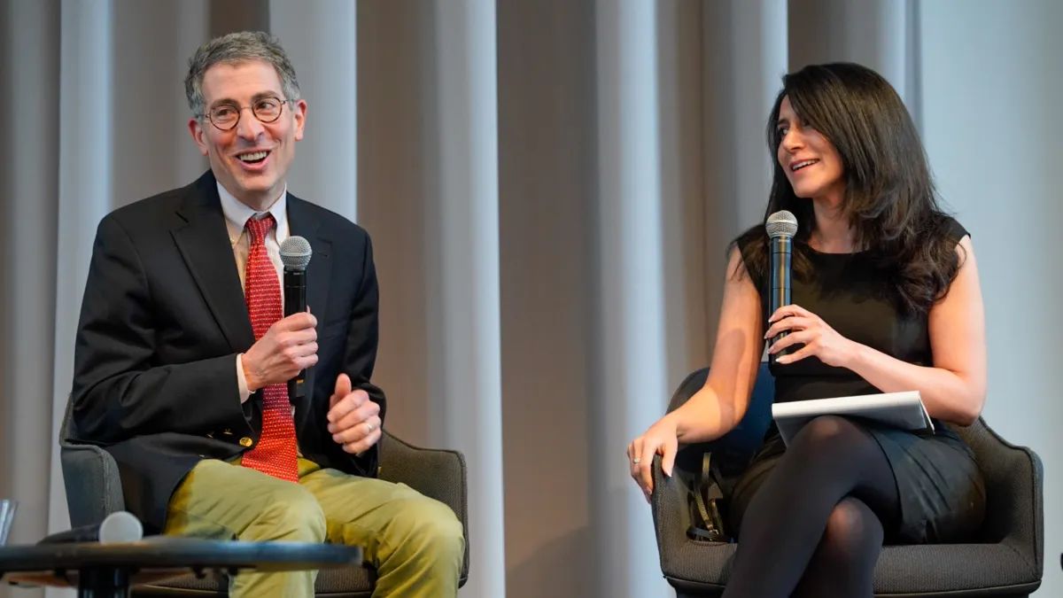 Two person panel on a stage. 