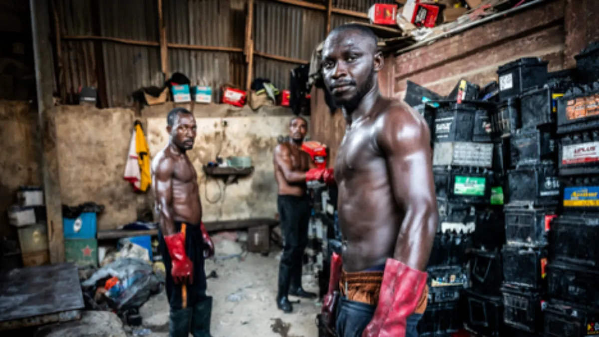 Workers known as breakers in Lagos, Nigeria prepare batteries for recycling. Photo by Finbarr O'Reilly for The New York Times.