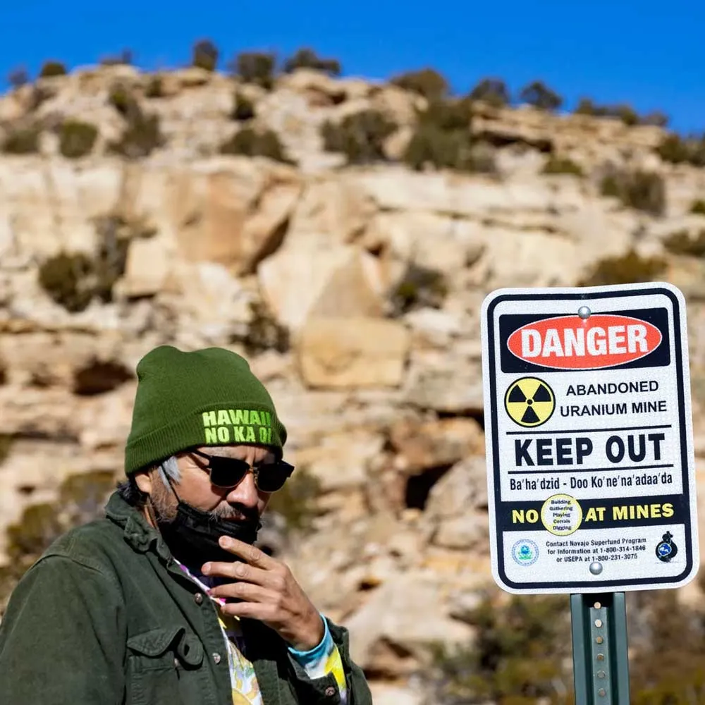 Man in front of a keep out sign