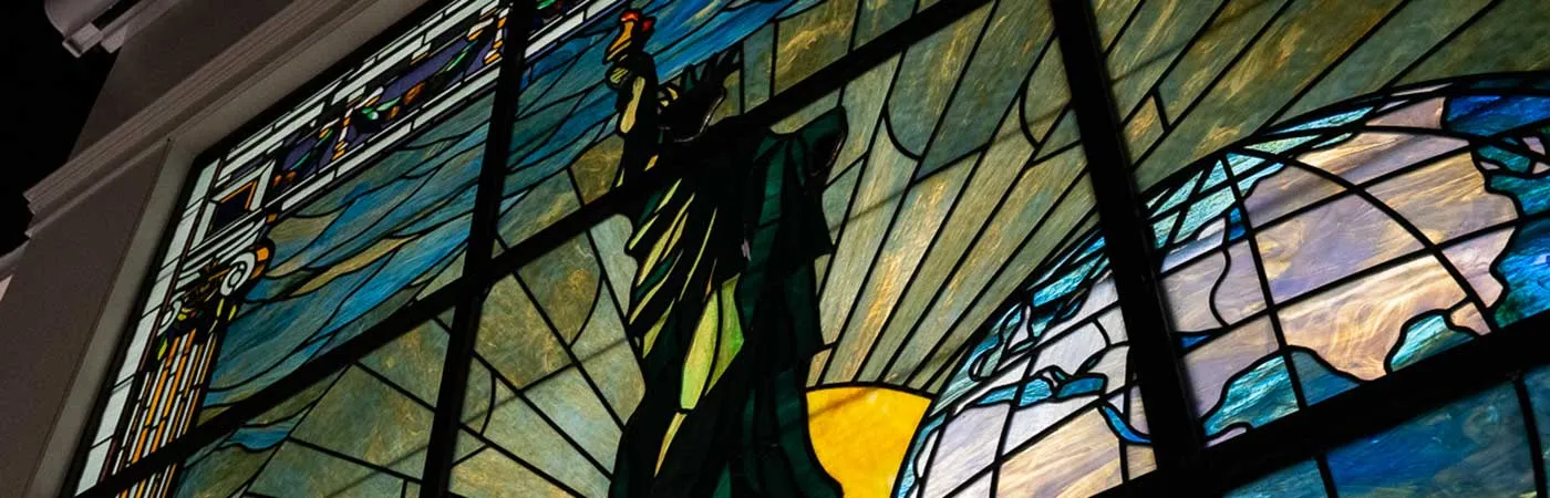 inset photo of stained glass window in Pulitzer Hall