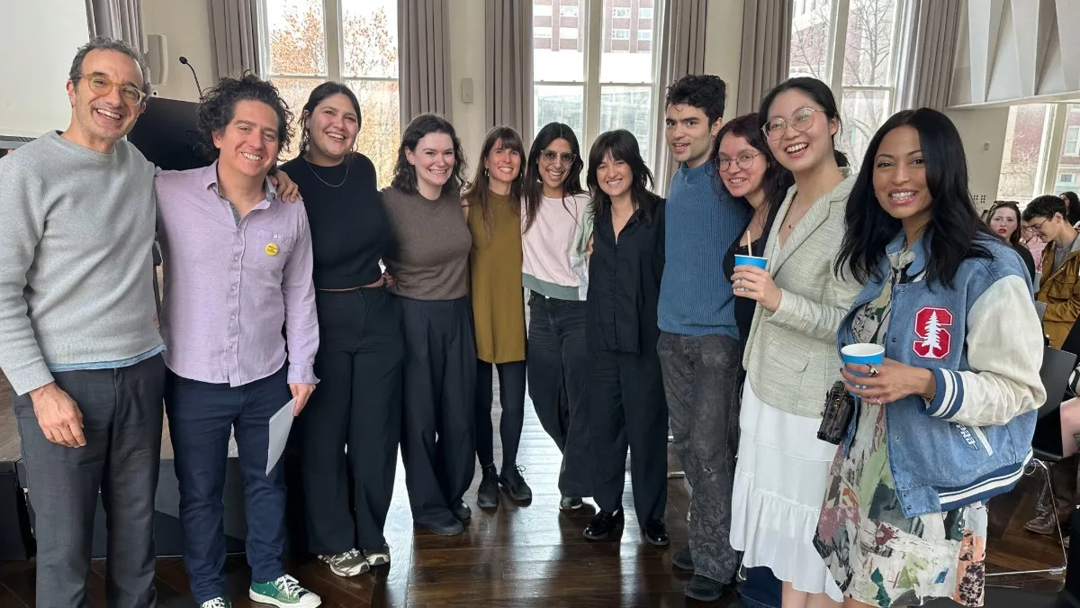 Group of students and professors pose for a photo. 