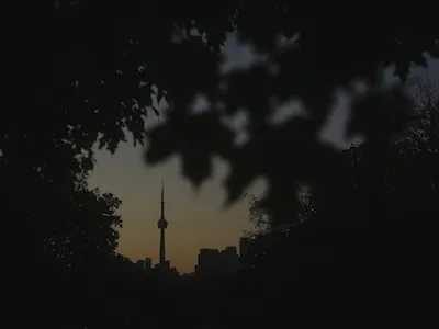 The CN Tower is seen from Trinity Bellwoods Park in Toronto on Wednesday, Sept. 18, 2024. (AP Photo/Angie Wang)