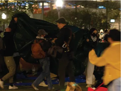 Demonstrators hastily remove tents from the secondary encampment to the front of Furland Hall 04/23/2024 22:56:02 Photo by Edward Lopez