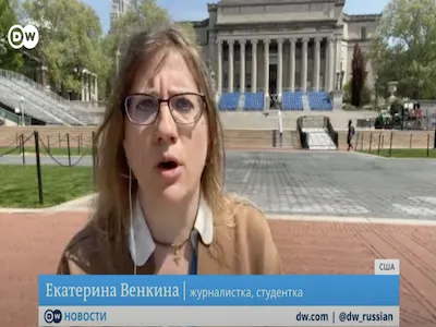 Ekaterina Venkina, '24 M.A., being interviewed with Lowe library in the background. 