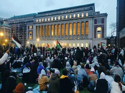 Columbia students gather on campus during protests in the evening. 