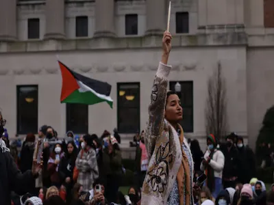 Student raises arm during campus protest. 