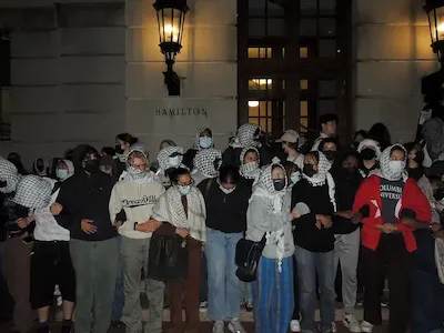 Students gather outside Hamilton Hall in protest. 