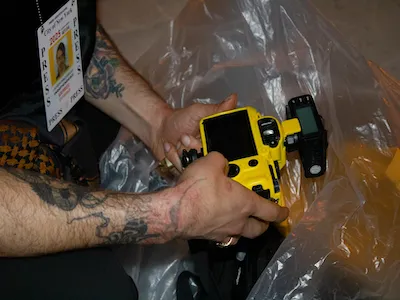 Photojournalist Josh Pacheco recovers their camera from an NYPD bag after being released from arrest on May 8, 2024. | Uzma Afreen
