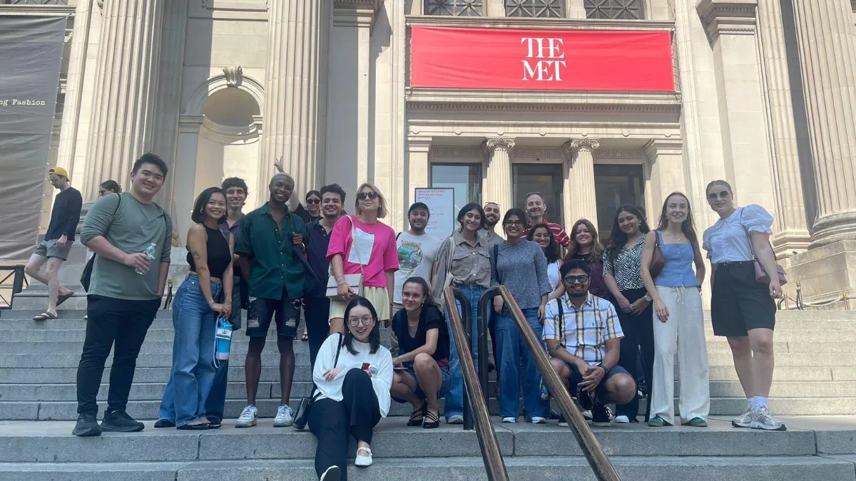 A group of students on the steps of the Metropolitan Museum of Art. 