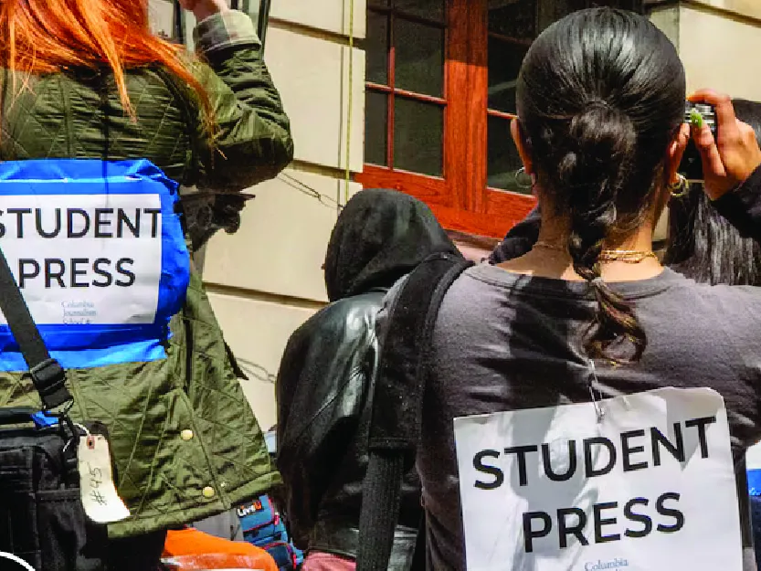 Photo of student journalists outside Hamilton Hall.  