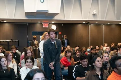 Student asks question at a CJS event. 